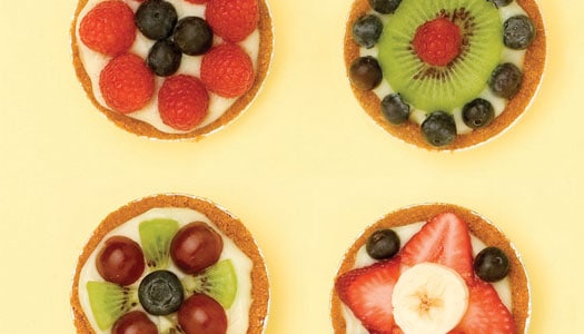 Close up of four fruit tarts