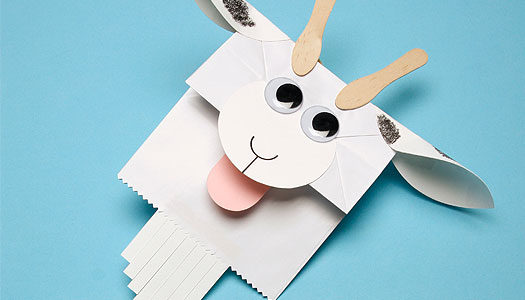 Close up of a creatively-made paper hand puppet made to look like a goat