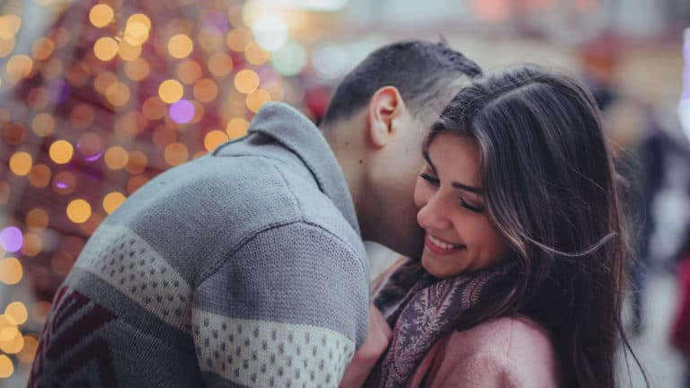 Couple's Christmas a husband and wife hugging