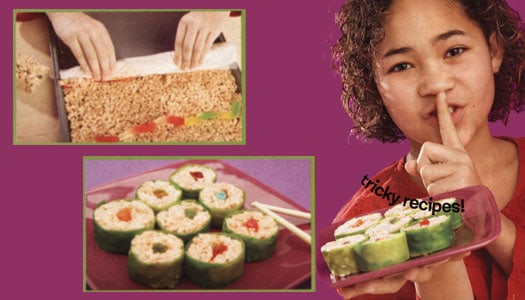 Girl holding finger to lips to say 'Shhh' while holding plate of rice krispie treats decorated to look like sushi
