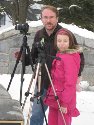 Girl and her dad with cameras
