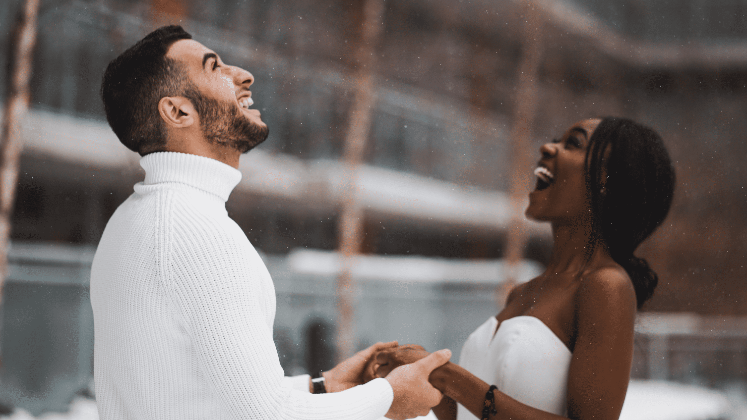 A man and woman dance in the snow