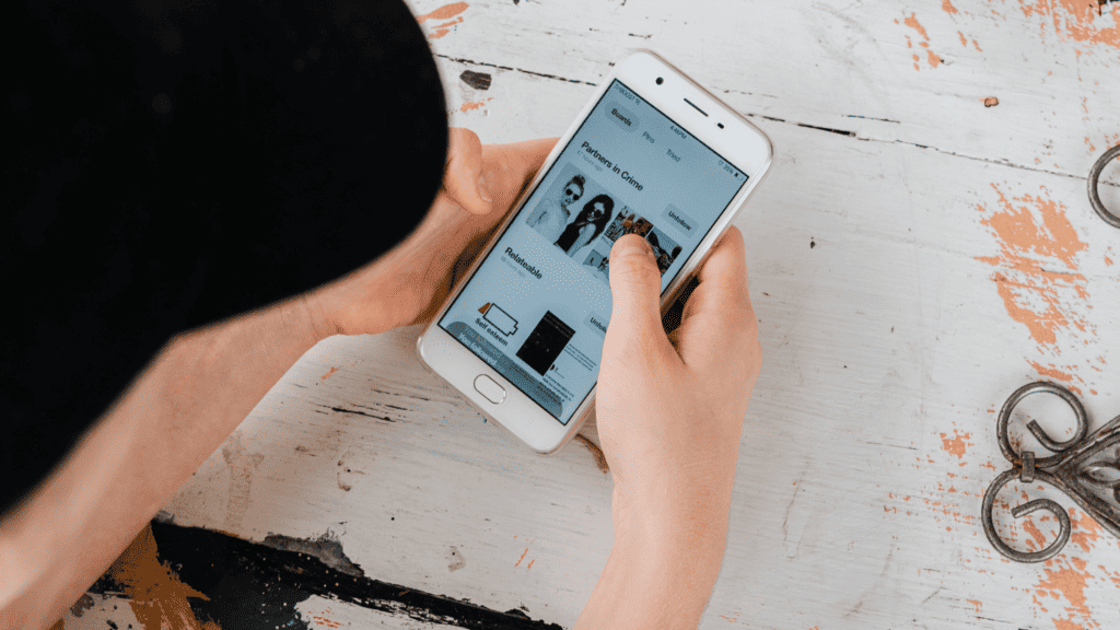 A woman checks her mobile hone