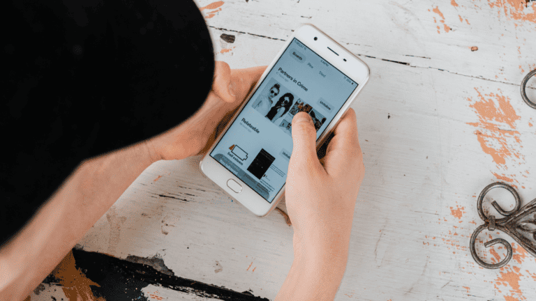 A woman checks her mobile hone