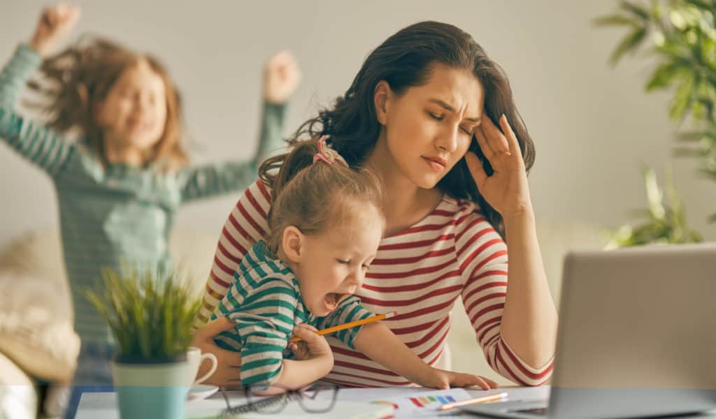 Mom working at home with kids