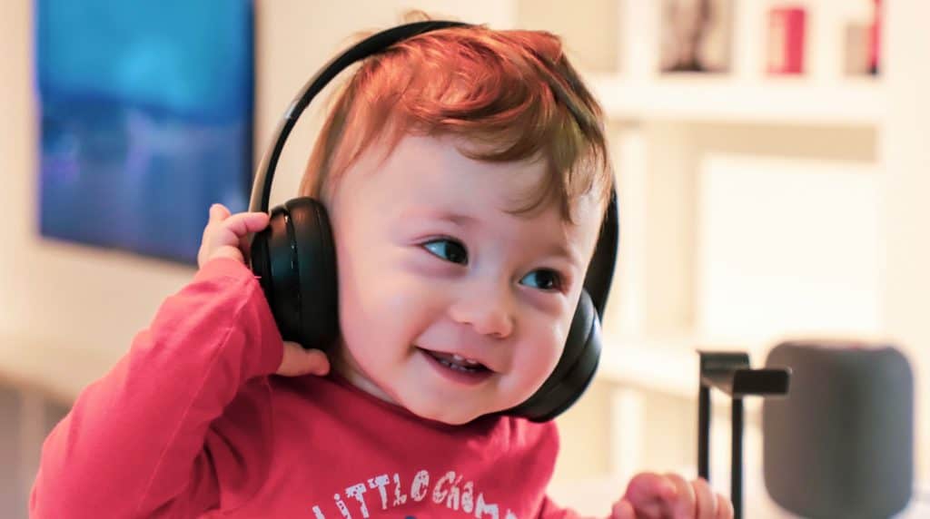 Child listening and learning through headphones