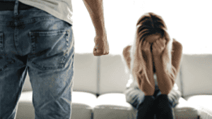 domestic violence husband fist wife crying