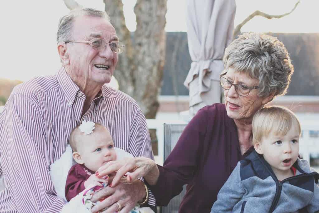 Elderly Parenting Playing With Grandchildren