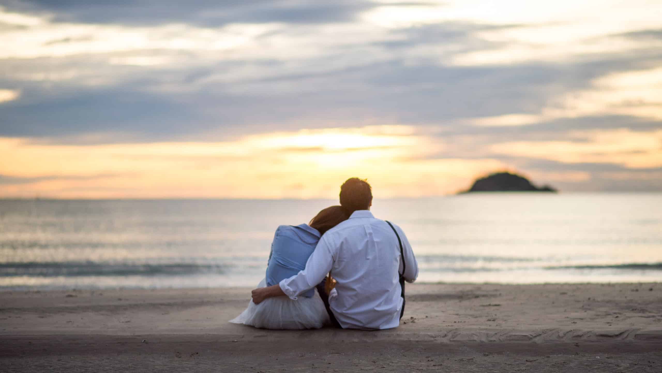 Couple watching sunrise celebrate Easter