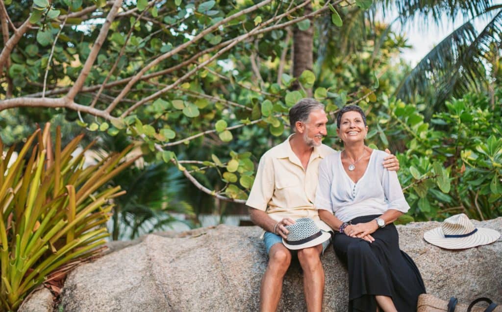 A couple sitting and talking about their retirement communication plan