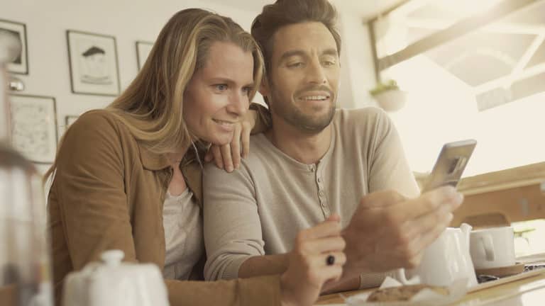 wife and husband watch marriage devotional text