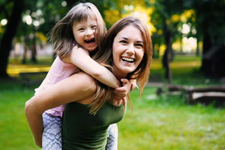 A mother caring for a special needs child who is outside their usual routine.