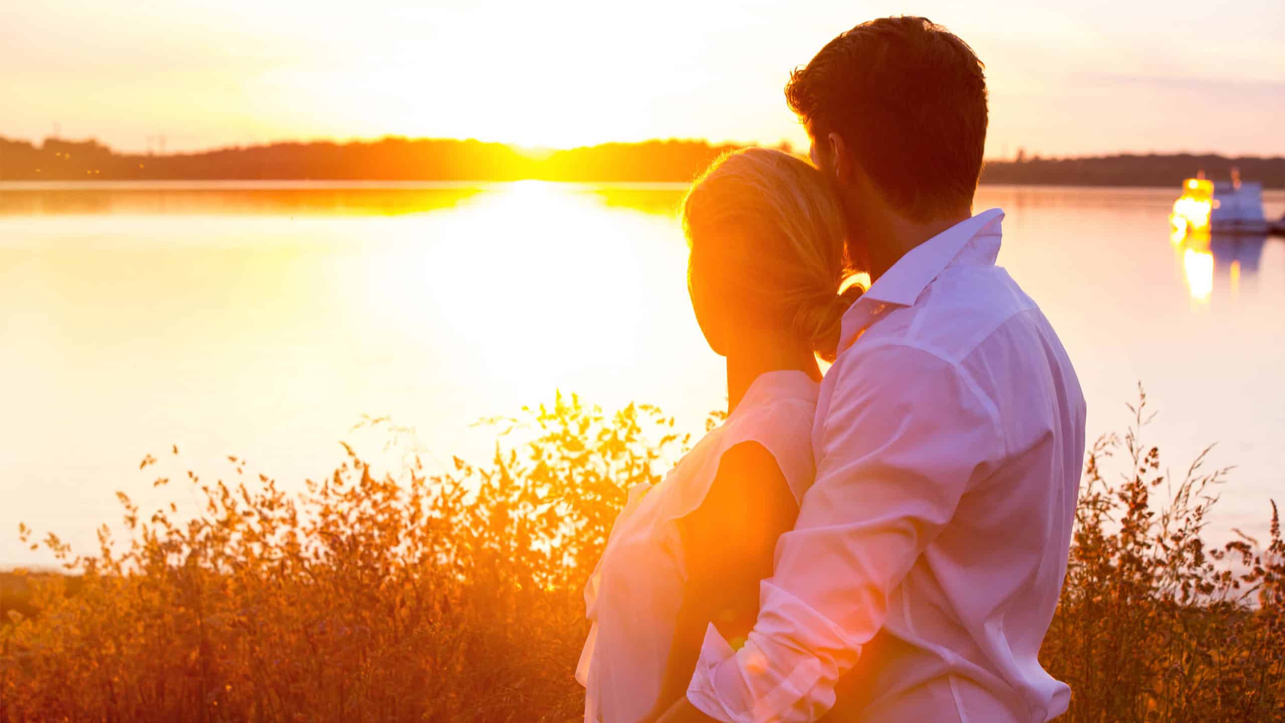 couple embrace at sunset