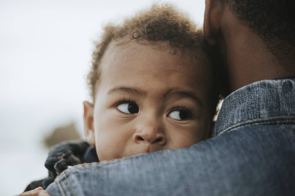 A father holds his child