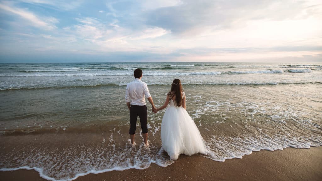 Married couple holding hands facing fear of marriage