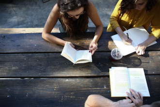 Students doing a Bible study at lunch table