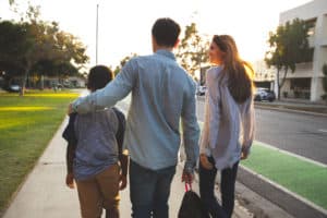 foster dad walking with family