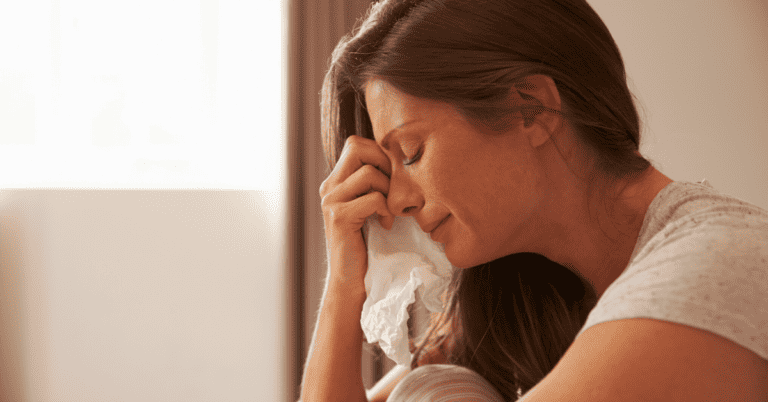 A woman crying.