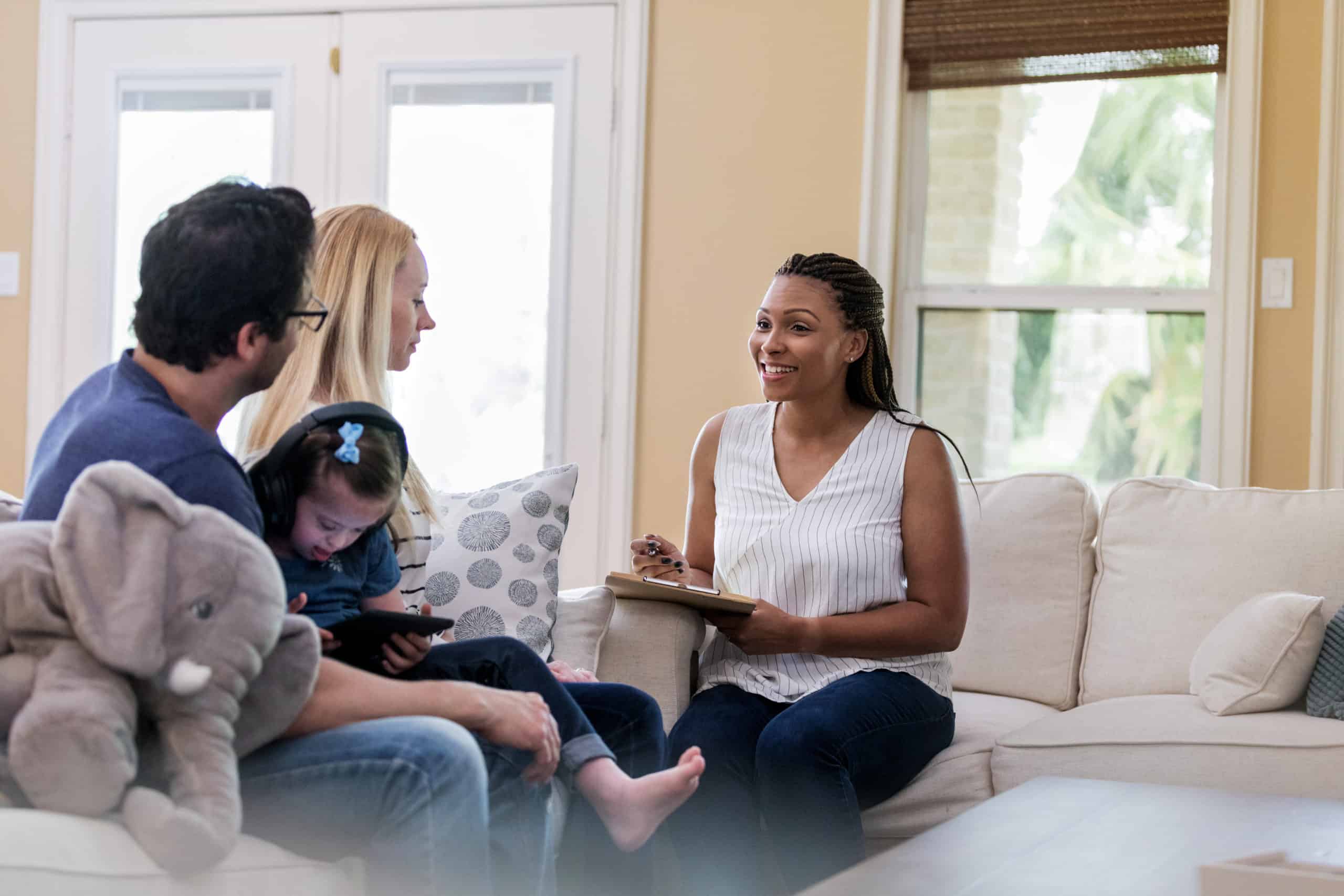 Social worker interviewing a family in their home