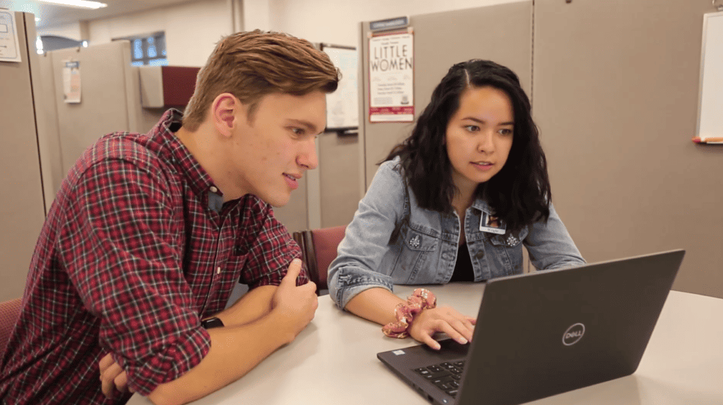 two employees working at computer