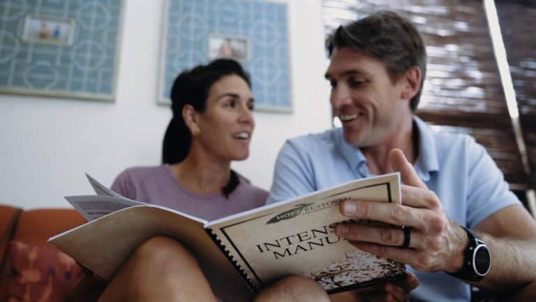 Eric and Katie reading a book together