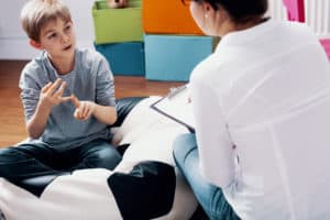 Child talking with counselor