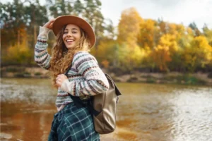 Young woman hiking near a river