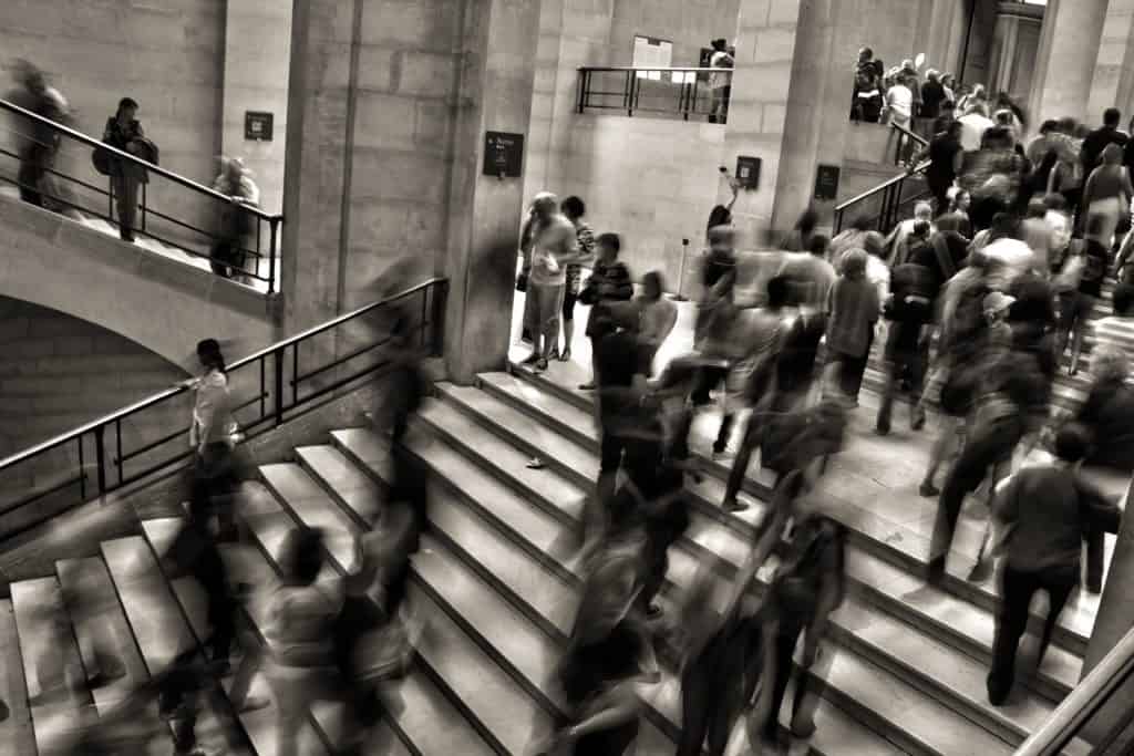 a blurred image of a busy train station