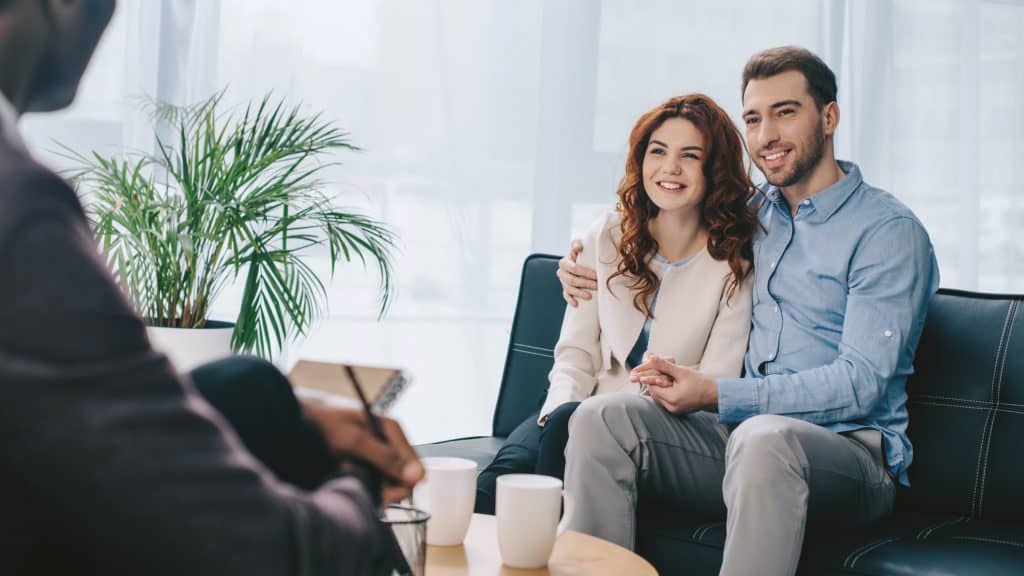 Couple being mentored in office setting