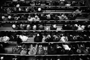 an aerial view of people sitting in church