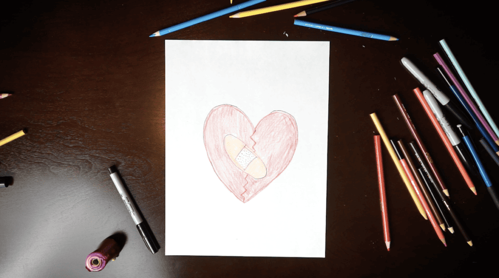 A child illustrates scriptures for healing a broken heart