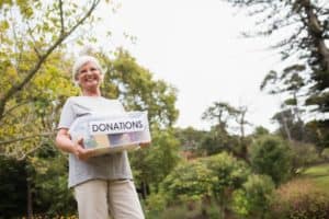 grandma holding donation box