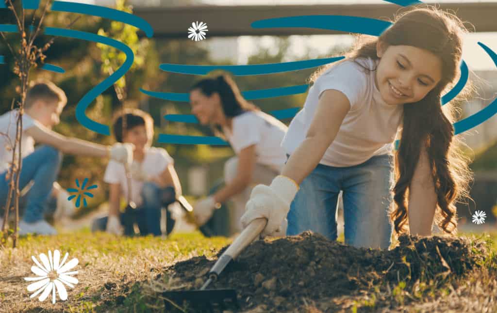 Child contributing to community and trying to make a difference by planting trees