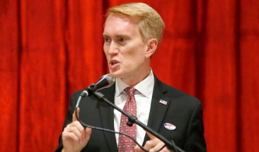 Senator James Lankford at a podium, giving a speech