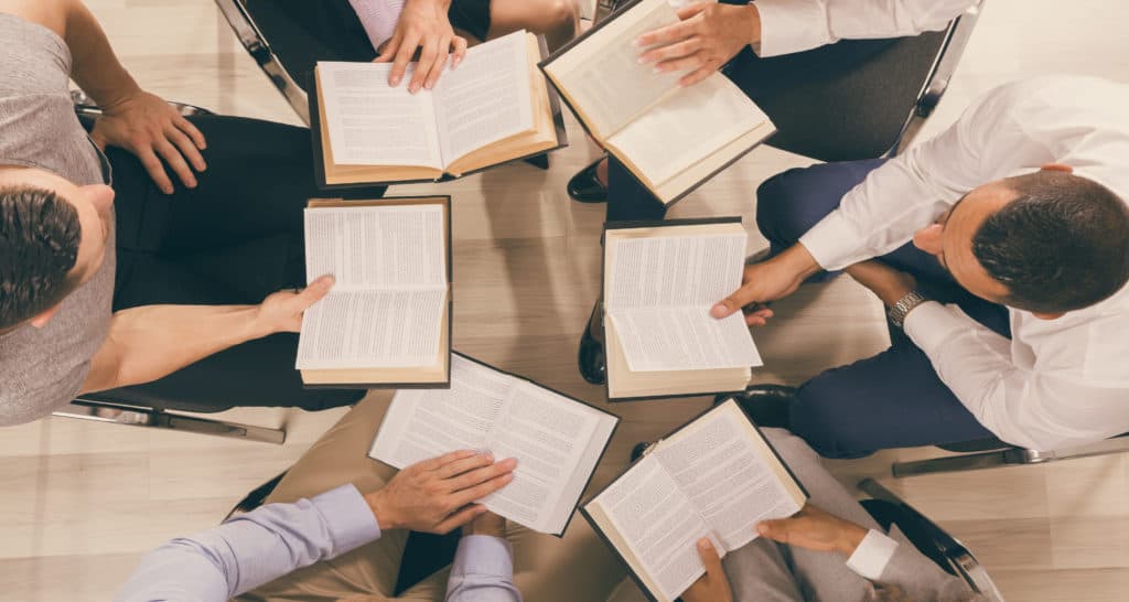 Group of people reading the Bible together