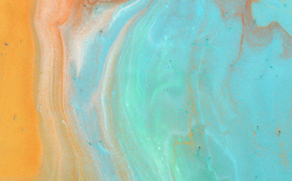 art photography of abstract marbleized effect background. Aqua, blue, gold and white creative colors