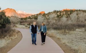 Treasure your spouse's differences - photo of Greg and Erin Smalley walking while holding hands