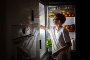 boy sneaking food