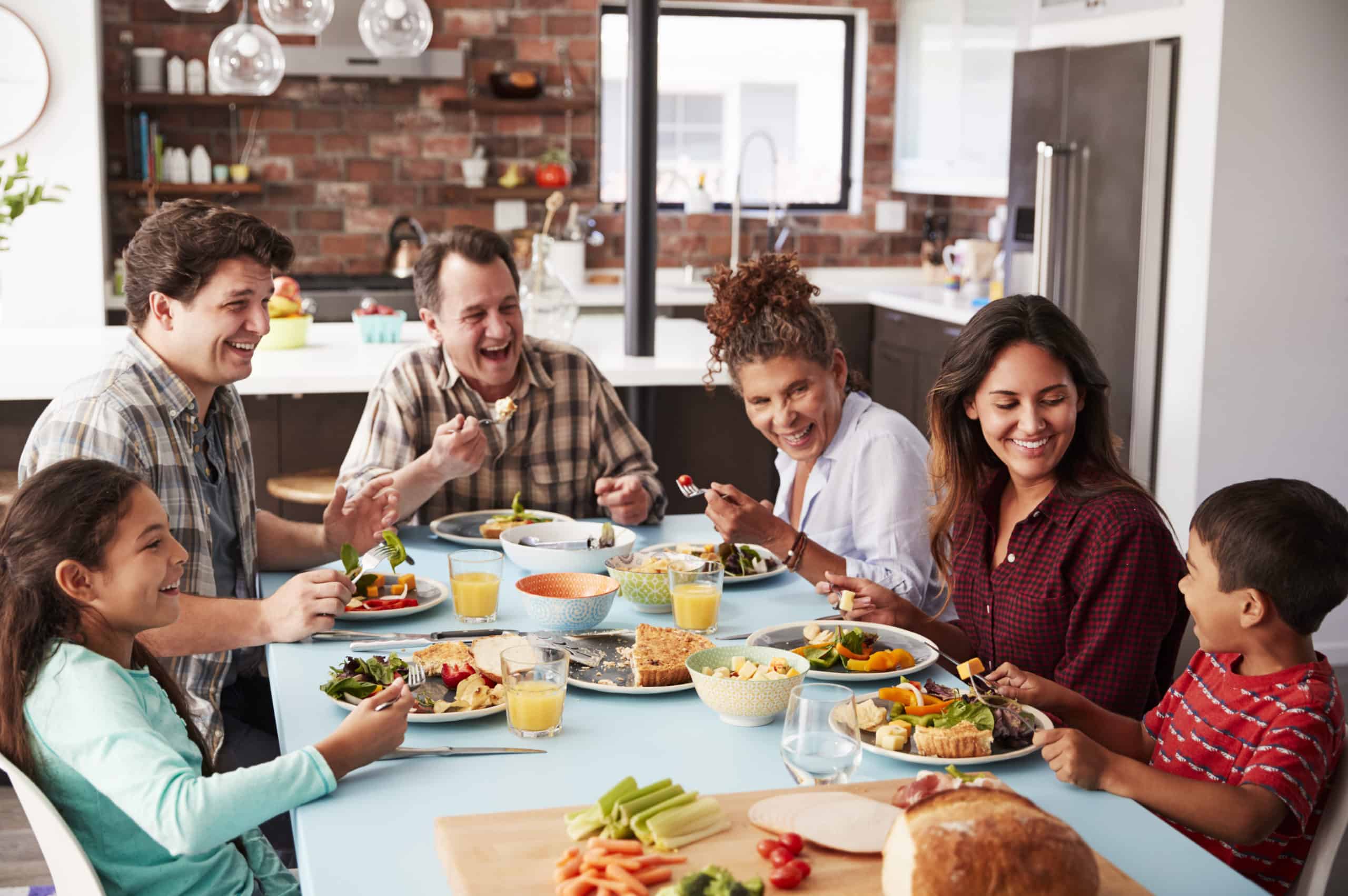 people talking across the kitchen table in asia