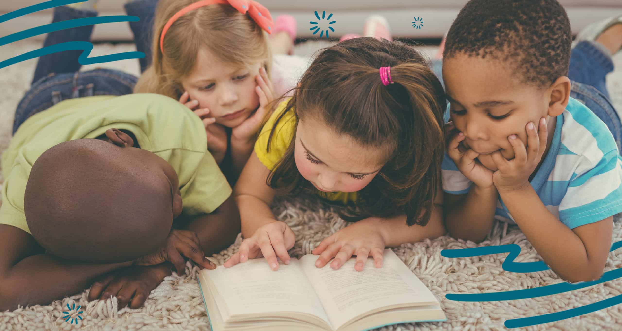 Four kids reading a book together
