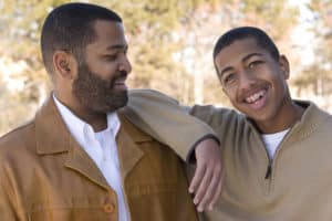 Foster dad and son outdoors