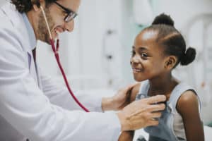 Pediatrician and girl in foster care