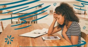 Girl sitting at kitchen table, having anxious feelings