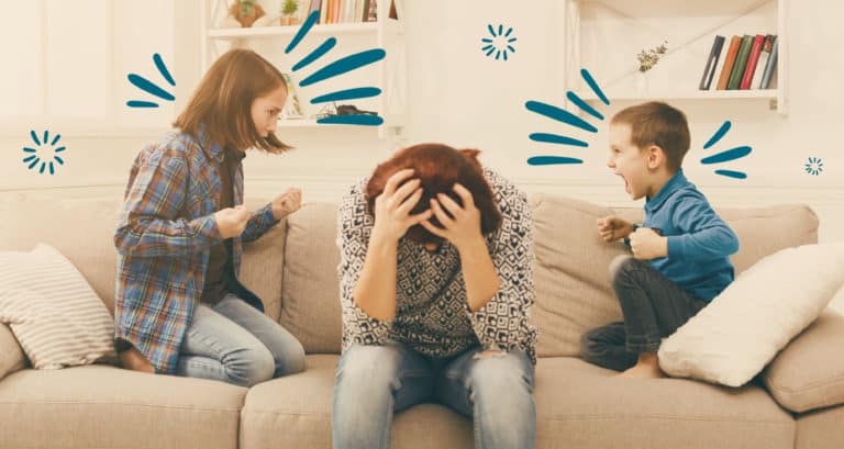 Two kids fighting with tired mom sitting in between them