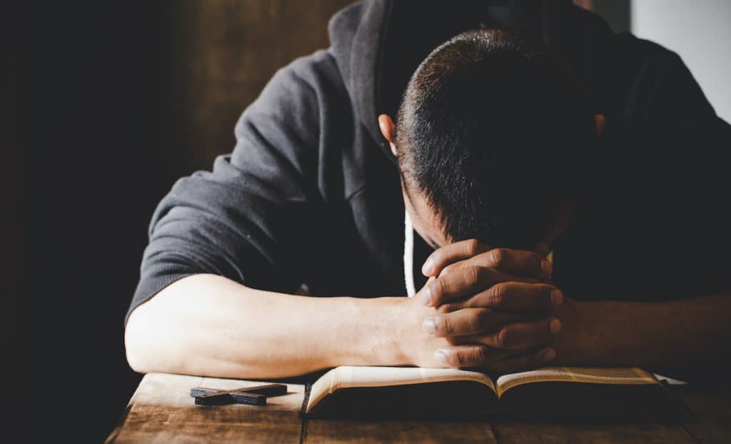 A young christian man prays against Christian abortion and how men feel about abortion.