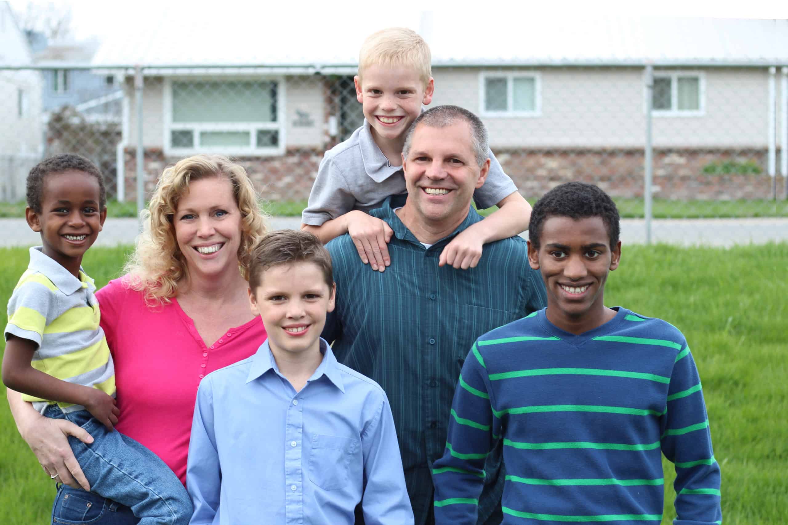 foster family with biological children and children in foster care