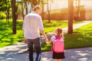 father walking daughter to school trust god