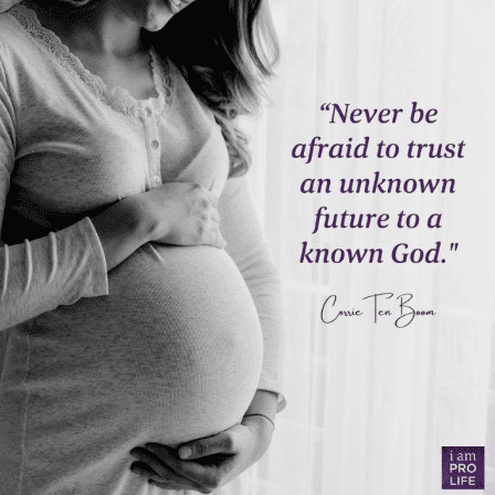 A pregnant woman holds her belly beside a quote from corrie ten boom Never be afraid to trust an unknown future to a known God. concerning adoption family and open adoption.