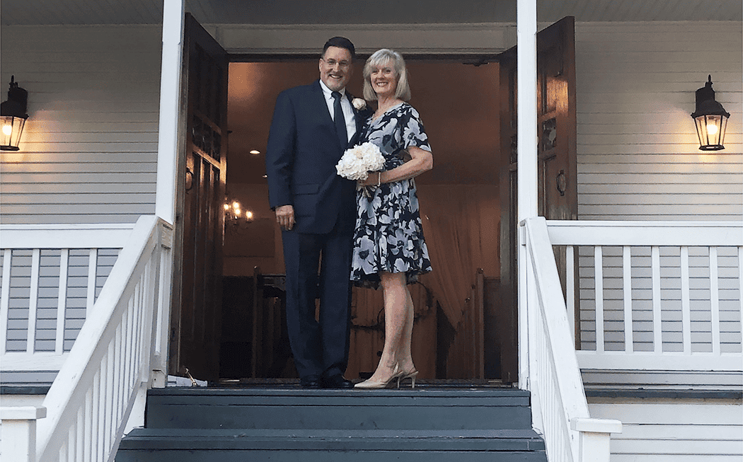 Rebuilding Their Family - Photo of Mike and Julie at the doors of a church