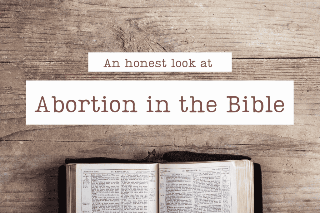 A Bible open on a wooden table with the title Abortion in the Bible.